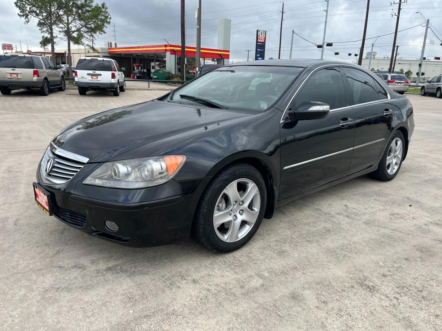 2005 Black /black Acura RL 3.5RL with Navigation System (JH4KB165X5C) with an 3.5L V6 SOHC 24V engine, 5-Speed Automatic Overdrive transmission, located at 14700 Tomball Parkway 249, Houston, TX, 77086, (281) 444-2200, 29.928619, -95.504074 - Photo#2